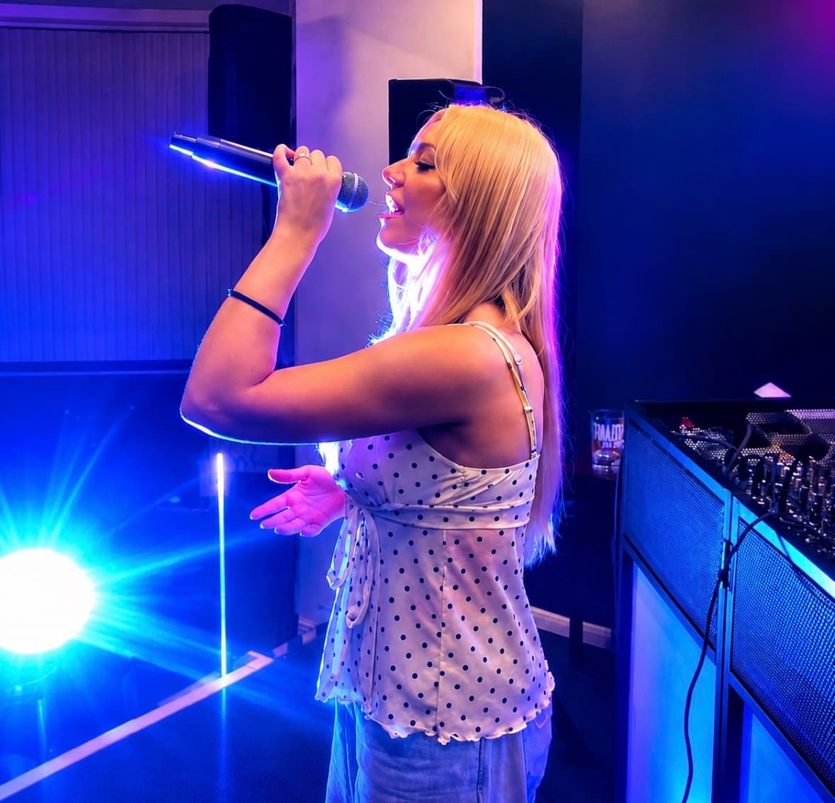 Abz performing live under stage lighting at a West Midlands venue